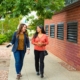 two woman going on walking meeting to increase creativity