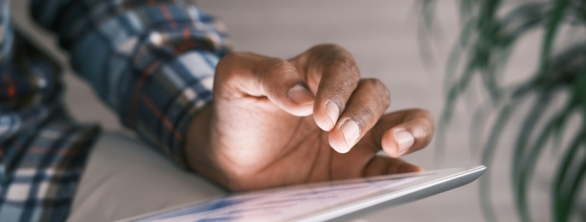 a photo of a benefits advisor looking at a benefits package image to help with employee retention