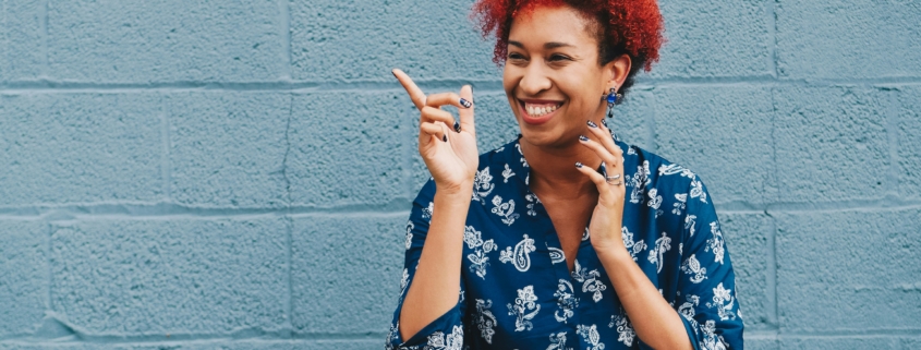 a happy employee showing that employee mental health matters.