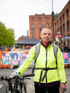 a woman with menopause who is biking to work 